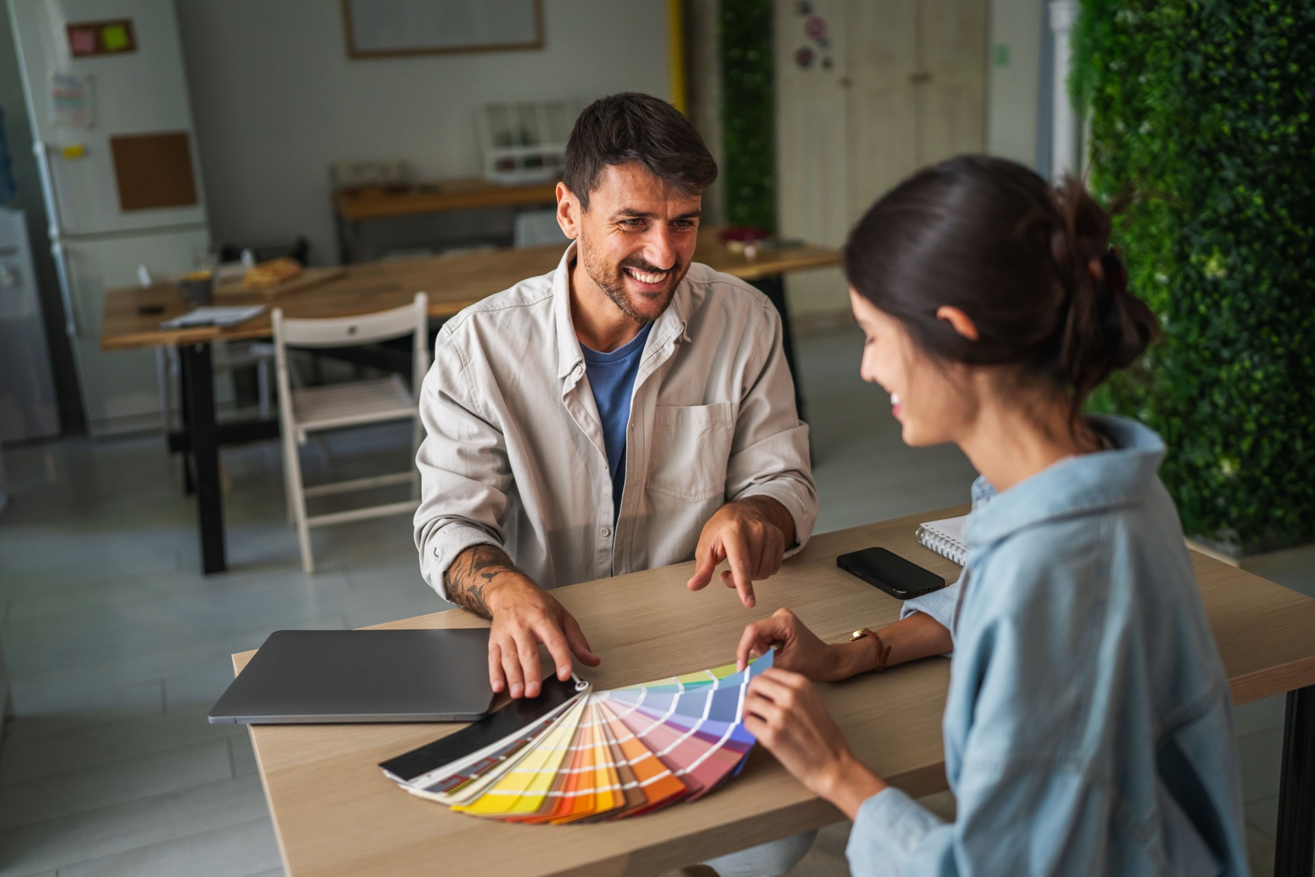 Designers collaborating on color palette for interior project